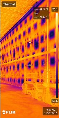 Thermal image of a warehouse wall showing a strong pattern through the concrete panels and their joints, with readings of spot 68.5 and box maximum 78.6 degrees Fahrenheit.
